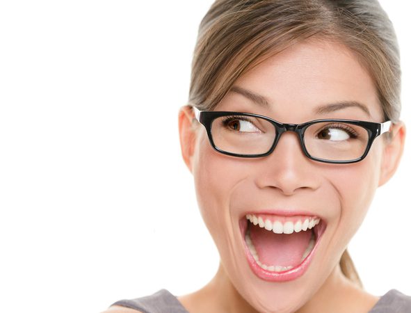 Excited woman looking sideways screaming of joy. Closeup of happy mixed race Asian Chinese / Caucasian female business woman isolated on white background.Click for more: